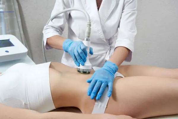 Lost the Weight but Not the Loose Skin? 2 woman having HIFU treatment on her stomach to combat loose skin Abingdon following weight loss